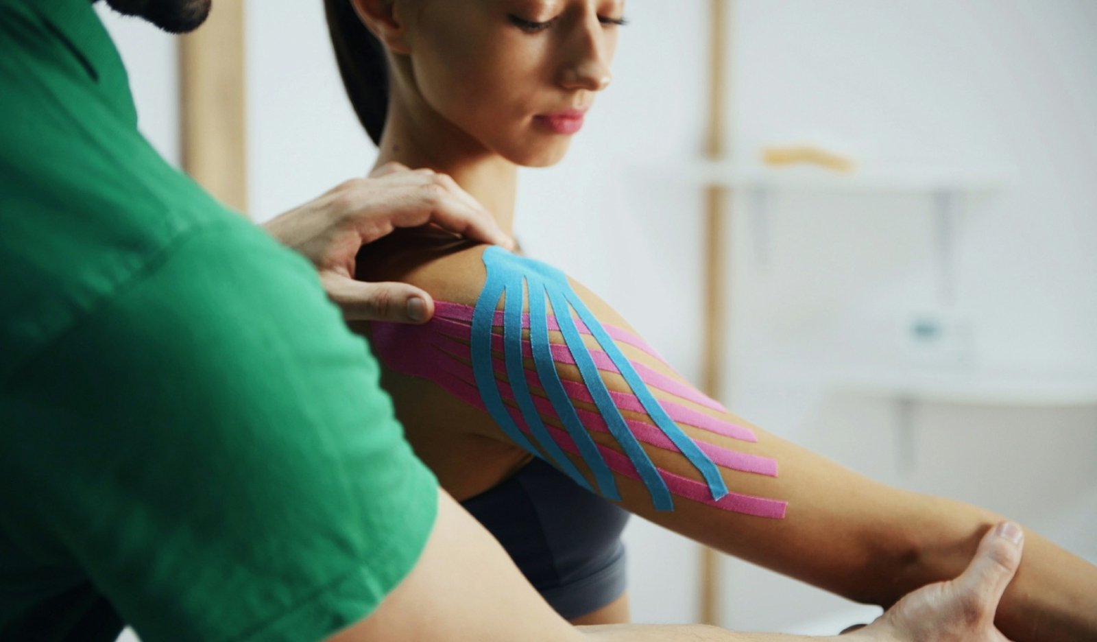 A physical therapist treating a patient during recovery