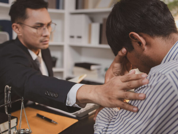Injury lawyer comforting a client