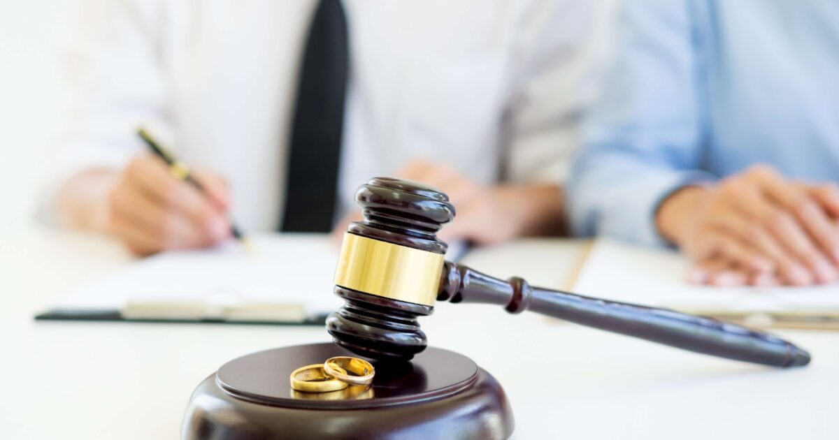 Couple signing a petition for dissolution of marriage