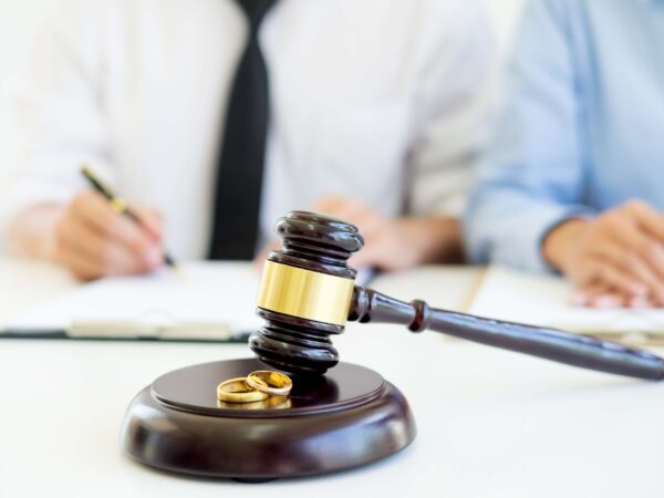 Couple signing a petition for dissolution of marriage