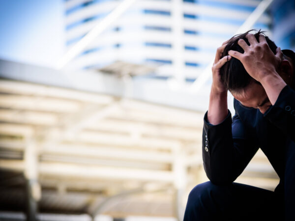 Asian businessman feel sad and frustrated upset