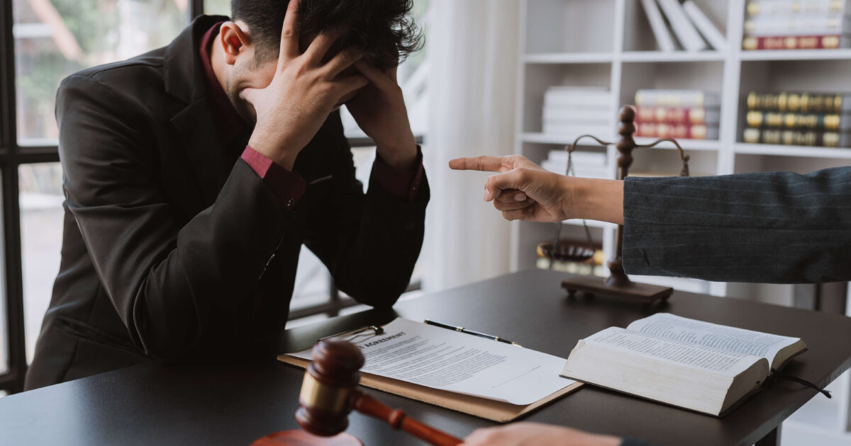 Businessman stressed with legal work