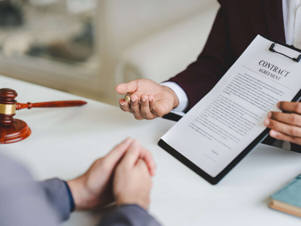 A lawyer explaining a client about a divorce settlement agreement