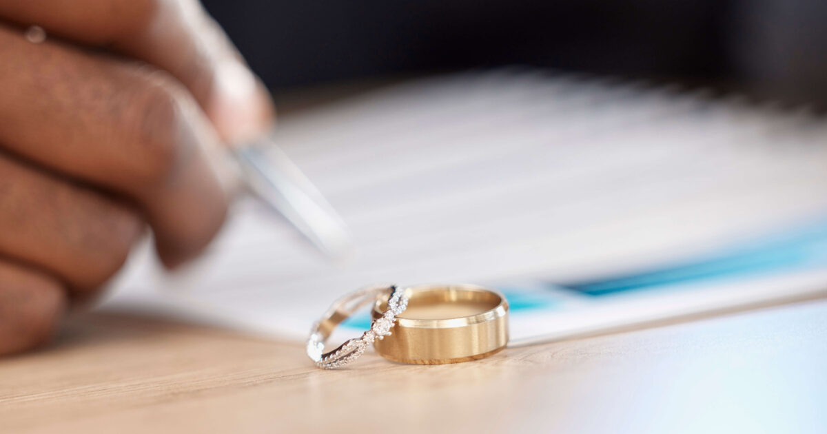 Divorce rings and signature on paperwork