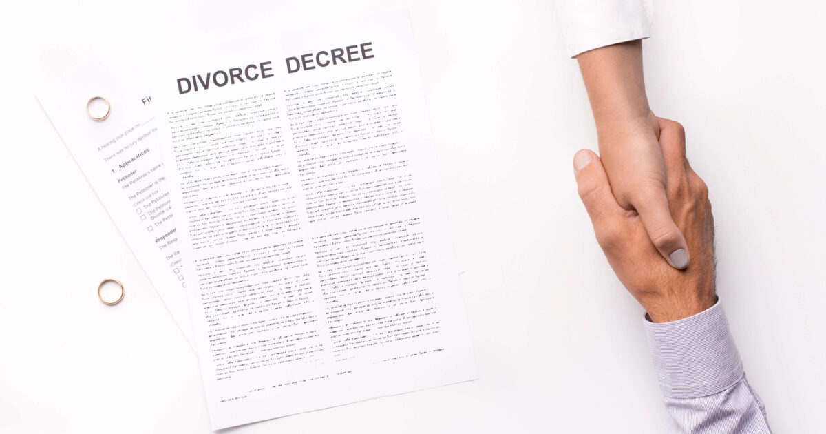 Husband and wife completing a divorce settlement