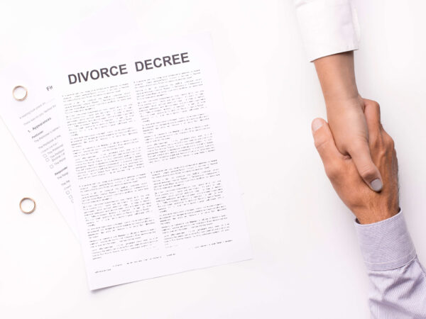 Husband and wife completing a divorce settlement