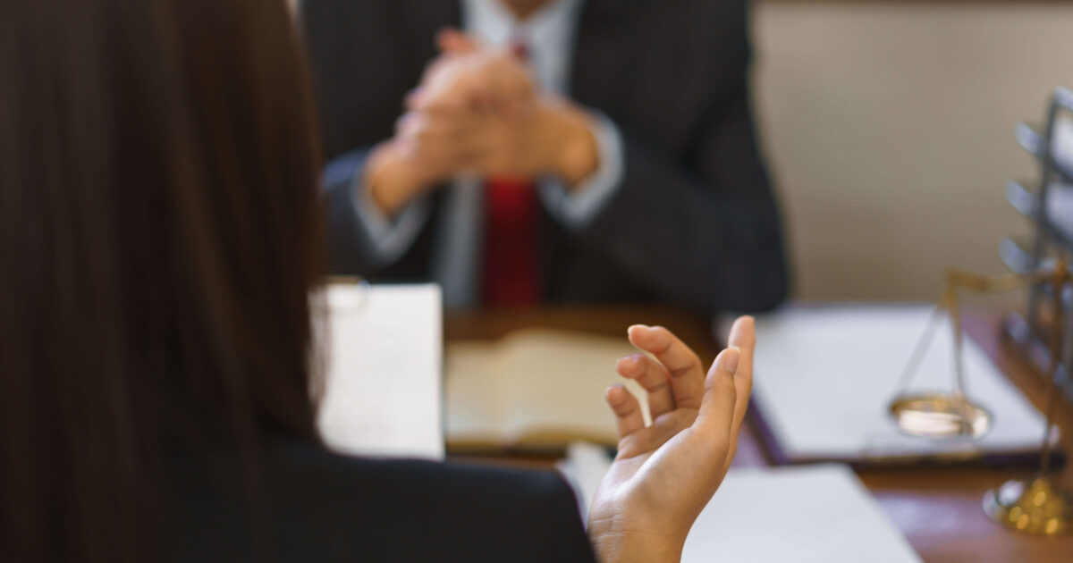 Two people in a divorce mediation hearing