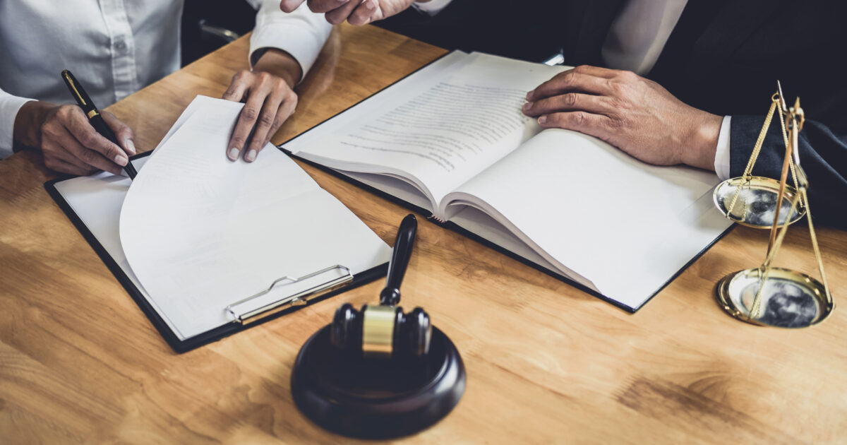 Lawyer and client working on a postnuptial agreement