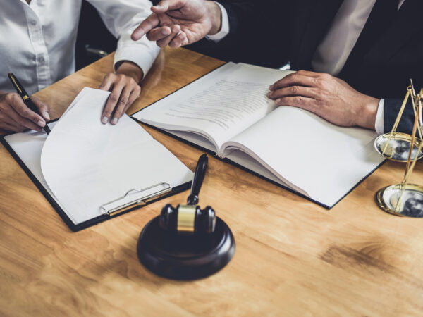 Lawyer and client working on a postnuptial agreement