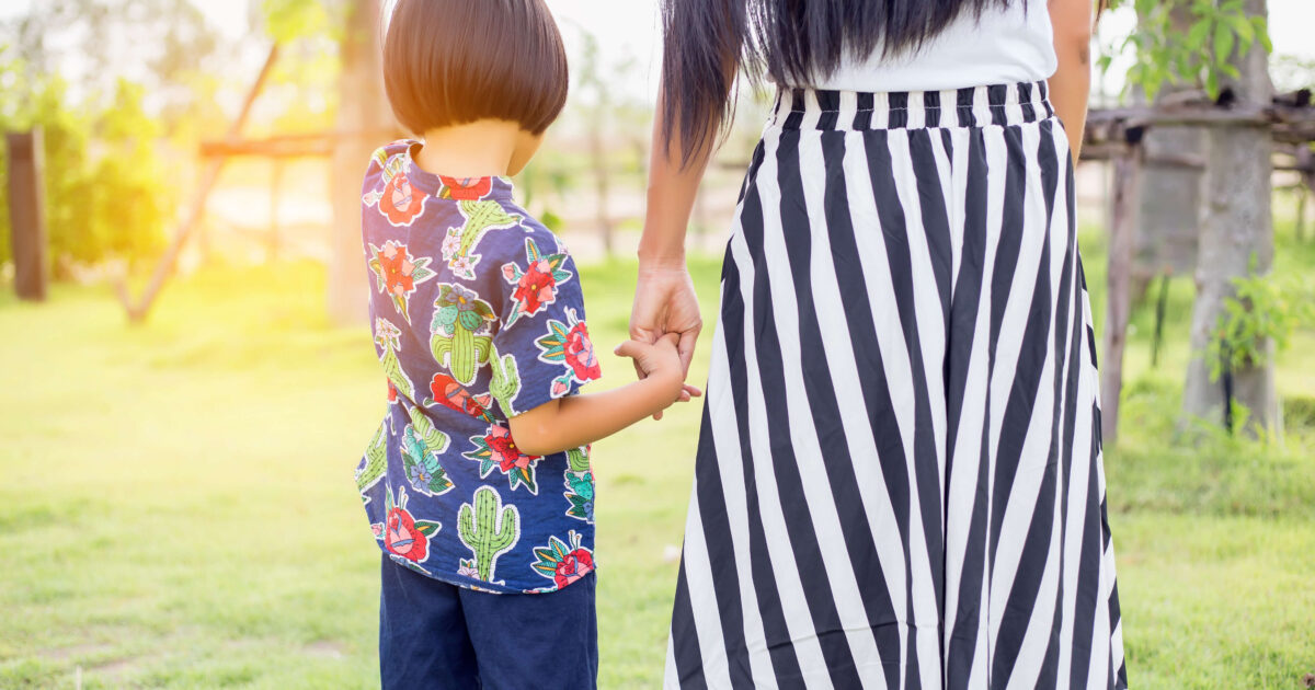Mother holding a child's hand