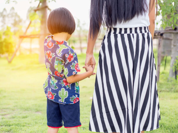 Mother holding a child's hand