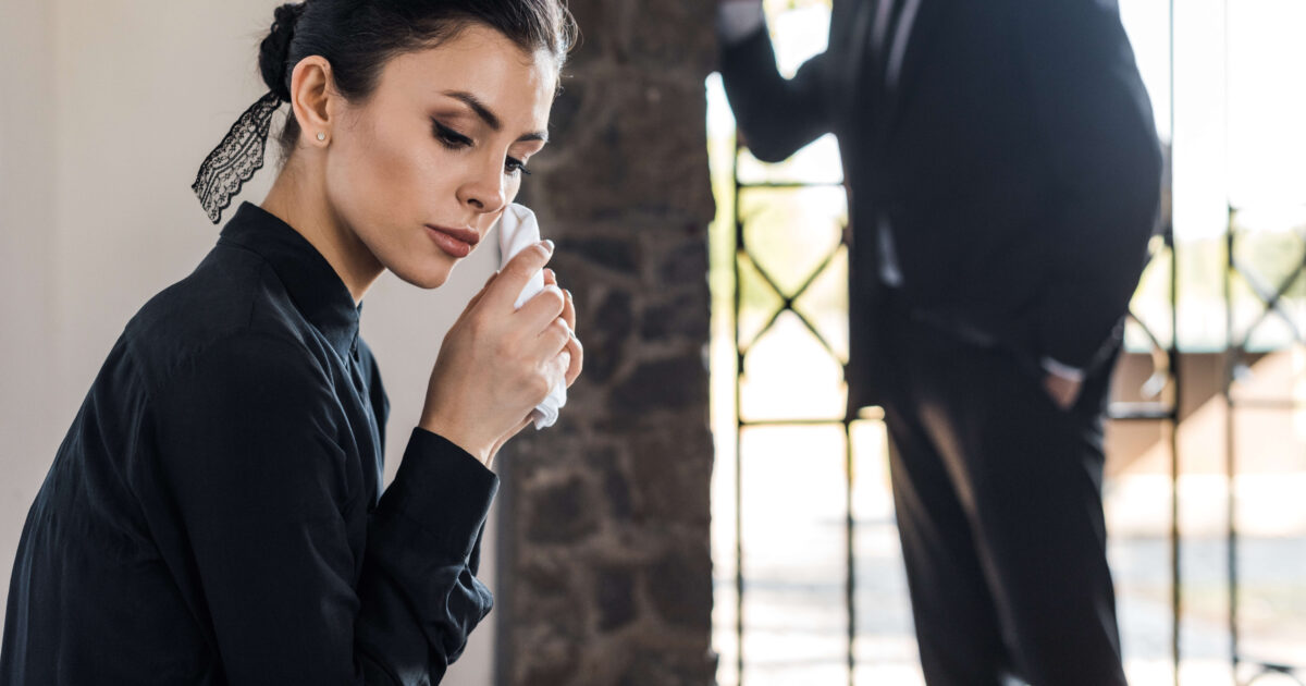 Selective focus of upset woman holding handkerchie