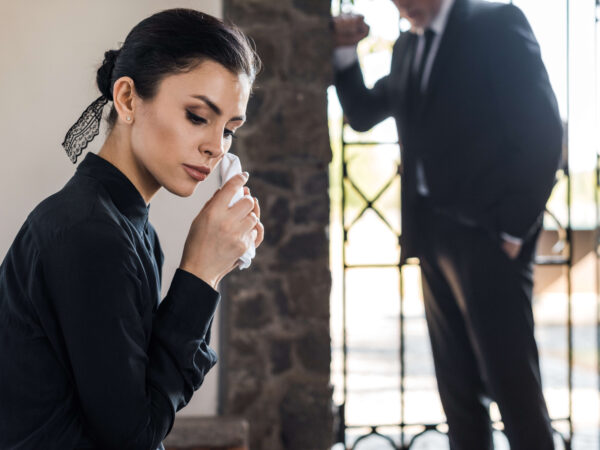 Selective focus of upset woman holding handkerchie