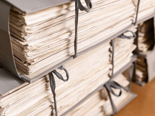 Stacks of old working paper documents