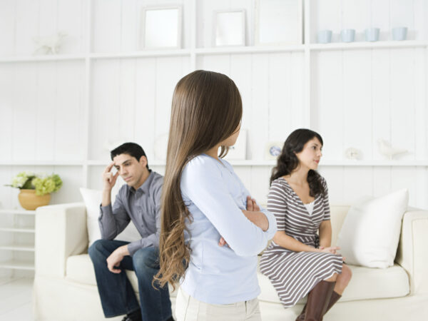 Girl looking at her hostile parents