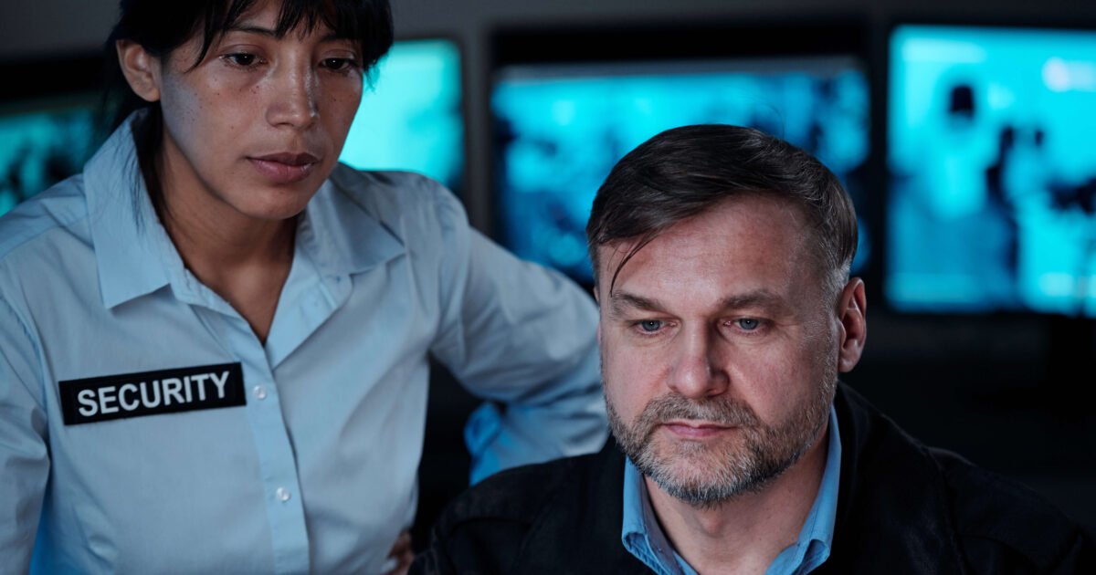 Security wards checking security cameras